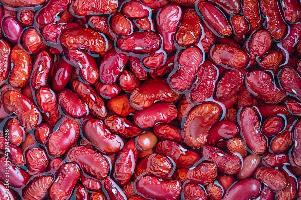 Red beans pattern as background in water, close up Red beans pattern as background in water, close up