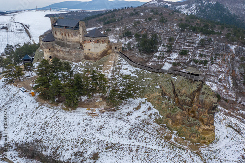 Hungary - Castle of Boldogko (Boldogkő) in Zemplen mountain. Hungarian historical castle in winter time with snow from drone view photo