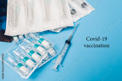 Covid-19 corona cirus 2019-ncov vaccine bottles with syringes. Vaccination, treatment of infection during pandemic.