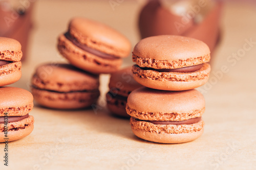 macaroons on a table. macarons on a table. Brown macaroon on a brown background 