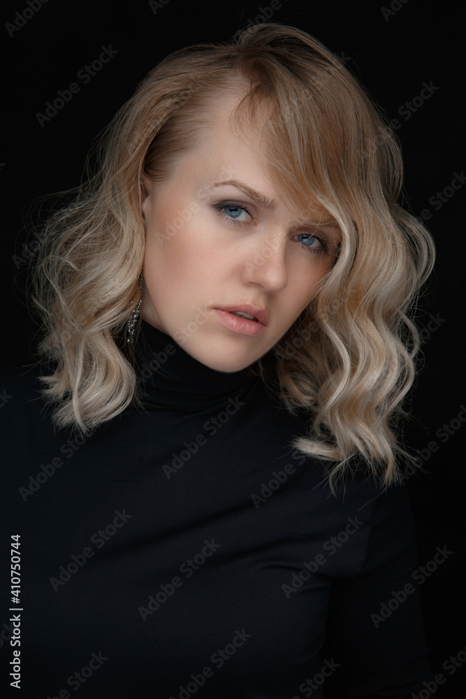 Perfect portrait of a beautiful woman on a black background. Beautiful blue eyes, natural beauty of clean skin, facial and hair care. Strong, thick hair. Perfect portrait of a beautiful woman on a black background. Beautiful blue eyes, natural beauty of clean skin, facial and hair care. Strong, thick hair.