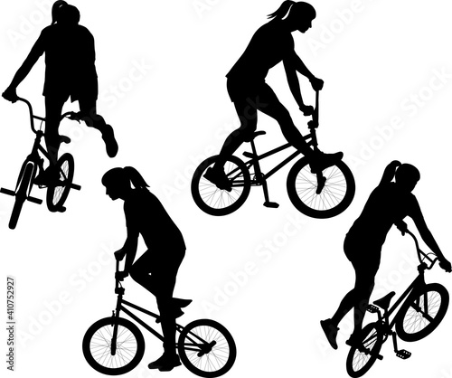 girl on BMX bicycle silhouettes