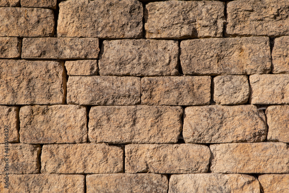 Fototapeta premium Old vintage yellow stone brick wall