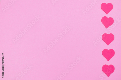 Bright pink hearts of love on the background. Line for frame with place for text and copy space. © Vladimir