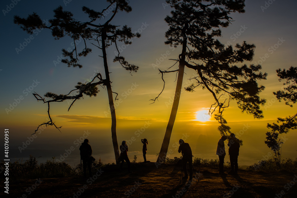 Silhouette Tourists on Pha Nok Aen Phukradueng, Thailand in the morning.