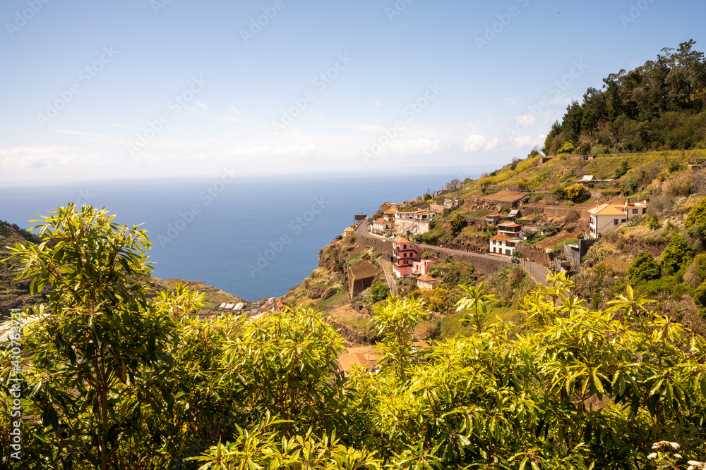 Lovely sea views over meadows and terraced cultivations to the Atlantic Ocean from the heights of the maderian levadas 