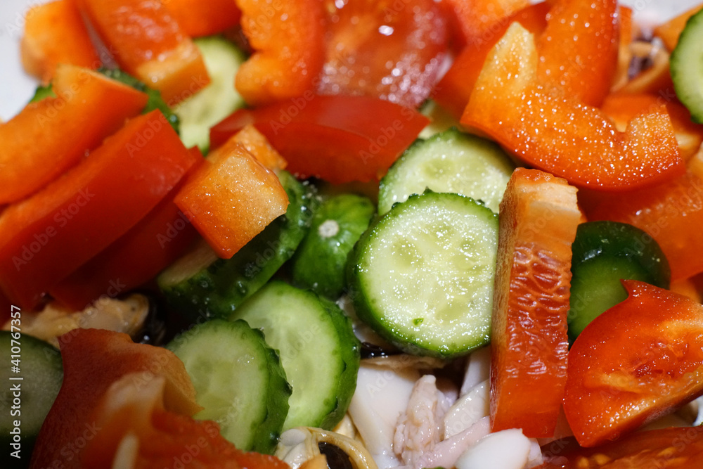 Green salad with tomatoes and cucumbers. Cabbage and red pepper. Green salad with tomatoes and cucumbers. Cabbage and red pepper.