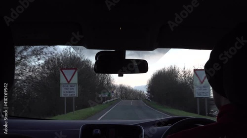 Timelapse of a man driving a car from inside the car.  The other cars speed past.  Shooting was done during the UK Corona Virus Lockdown oover the North Wales Boarder