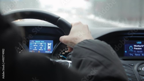 Turn signal of the car right on dashboard woman driving hand closeup
