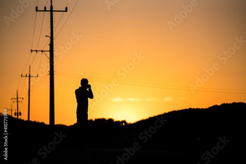 Photographer silhouette in a sunset