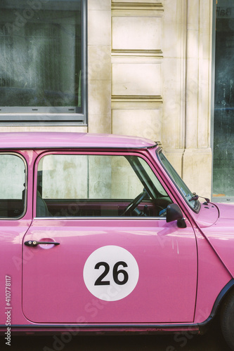 Pink car in the street