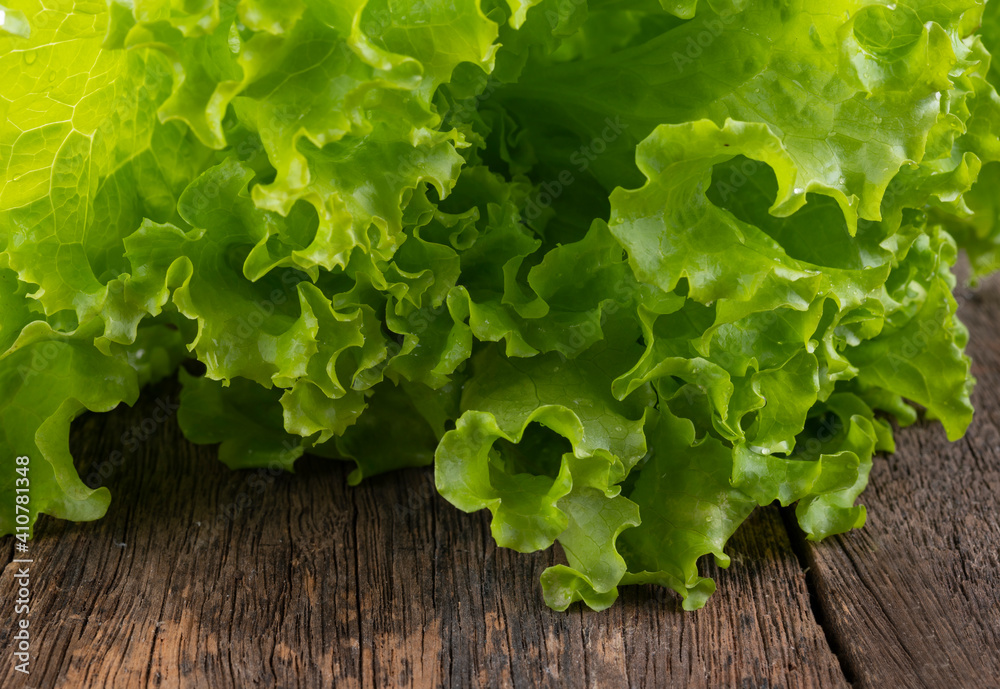 Fresh lettuce on wooden background Fresh lettuce on wooden background
