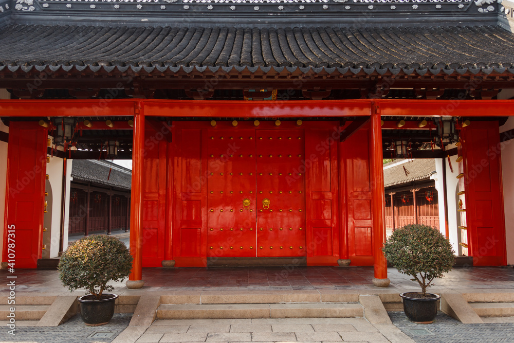 Large, red, traditional Chinese door in Confucius temple in Shanghai