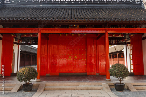 Large, red, traditional Chinese door in Confucius temple in Shanghai