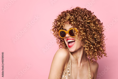 Model curly hair Fun red lips emotion pink background 