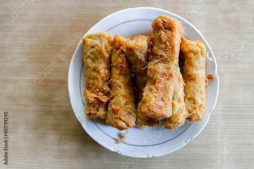 Fried spring rolls or popia or lumpia in white plate