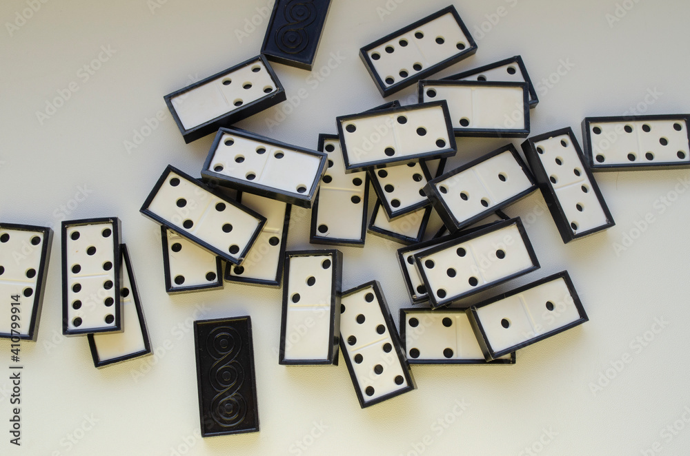 dominoes scattered on white background dominoes scattered on white background