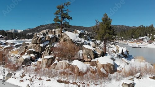 Aerial View flying over a Big Bear Lake during Winter in California