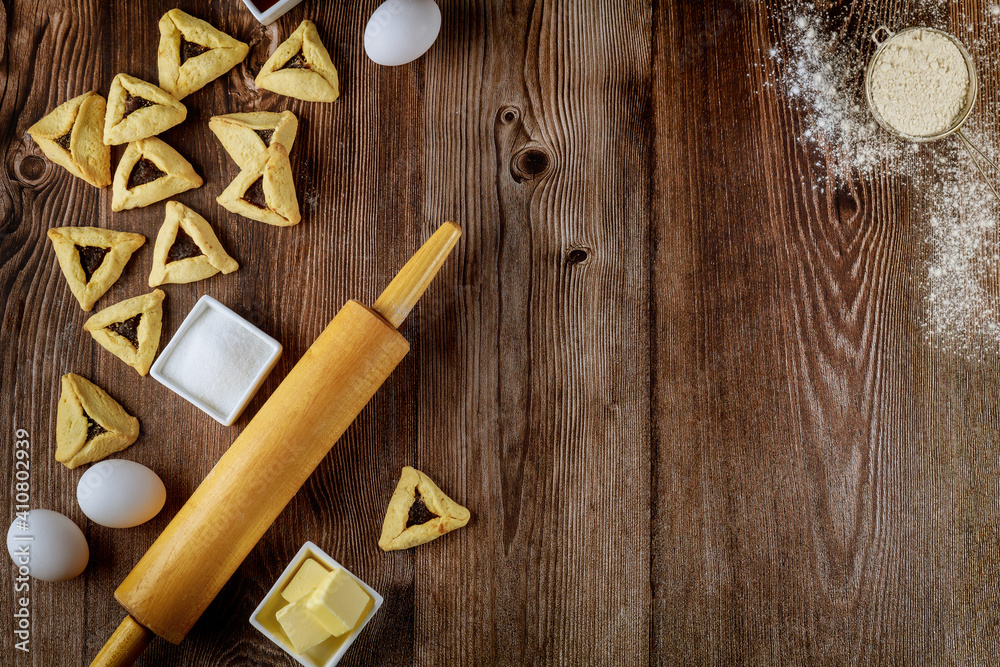 Baked hamantaschen jewish cookies with ingredients. Baked hamantaschen jewish cookies with ingredients.