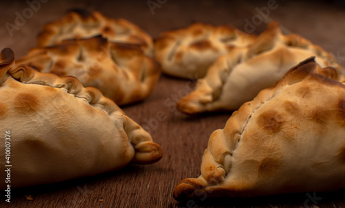 Traditional Argentinean empanadas pie on table, meat Chicken and vegetables