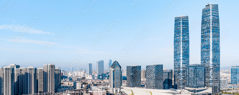 Sunny view of Kunming twin towers and city skyline in Yunnan, China 