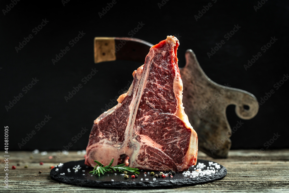 The T-bone or porterhouse steak of beef cut from the short loin. steak  include T-shaped bone with meat on each side. T-Bone Steak or aged wagyu  porterhouse Photos | Adobe Stock