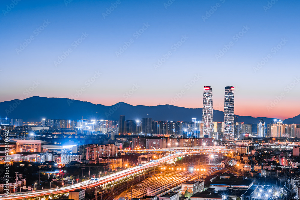 Night view of the twin towers, viaduct and railway station in Kunming, Yunnan, China 