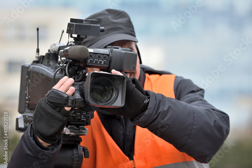 TV camera man filming a political event © Flavijus Piliponis