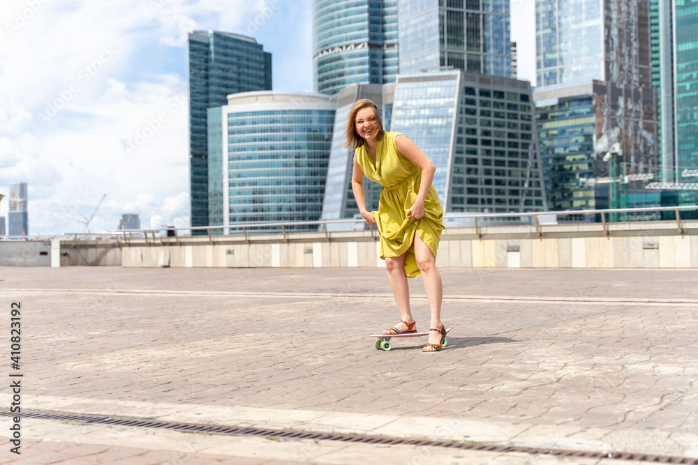 30th woman is learning to skateboard. active lifestyle 30th woman is learning to skateboard. active lifestyle