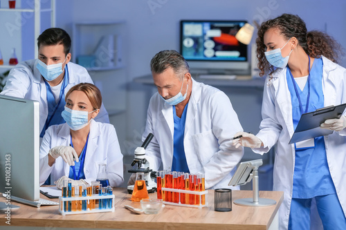 Scientists working with sam...