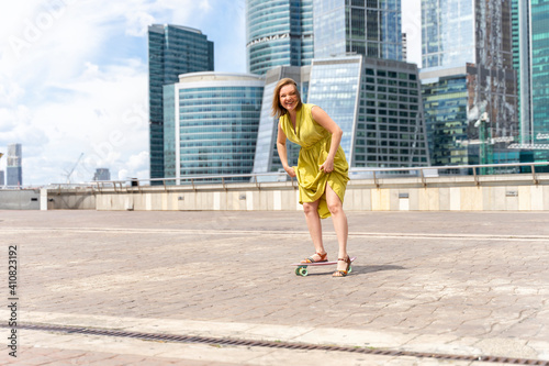 30th woman is learning to skateboard. active lifestyle