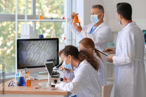 Scientists working with sam...