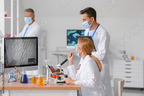 Group of scientists working...