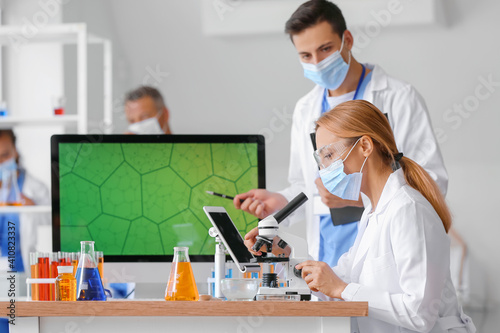 Group of scientists working...