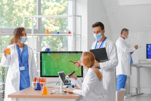 Group of scientists working...
