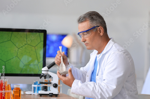 Male scientist working with...