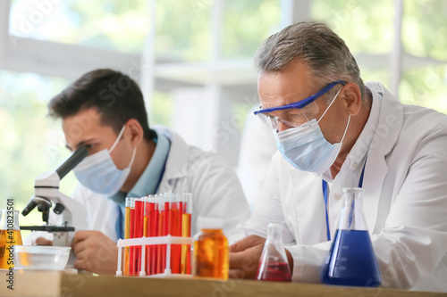 Scientists working with sam...