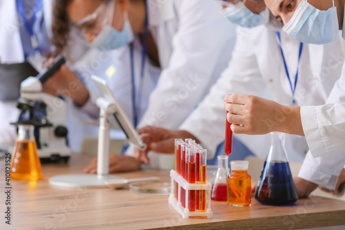 Scientists working with sam...