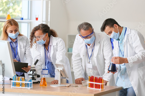 Scientists working with sam...