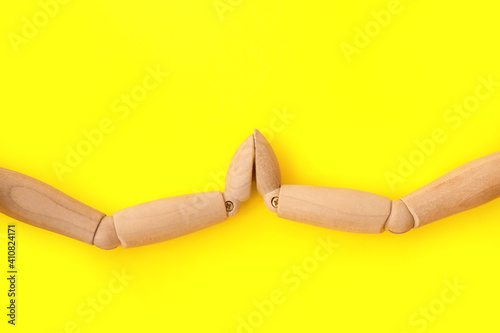 Wooden mannequins holding h...