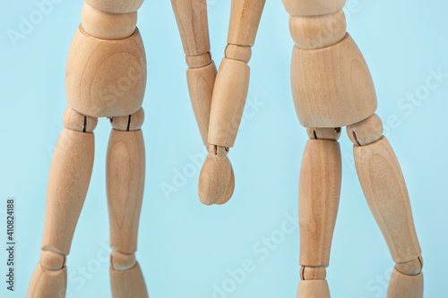 Wooden mannequins holding h...
