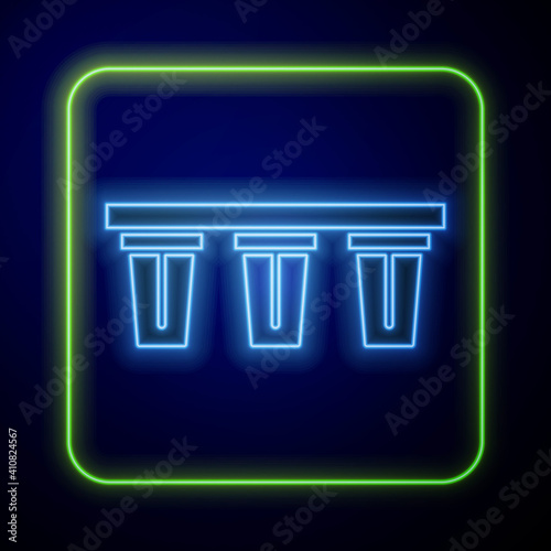 Glowing neon Water filter icon isolated on blue background. System for filtration of water. Reverse osmosis system. Vector.