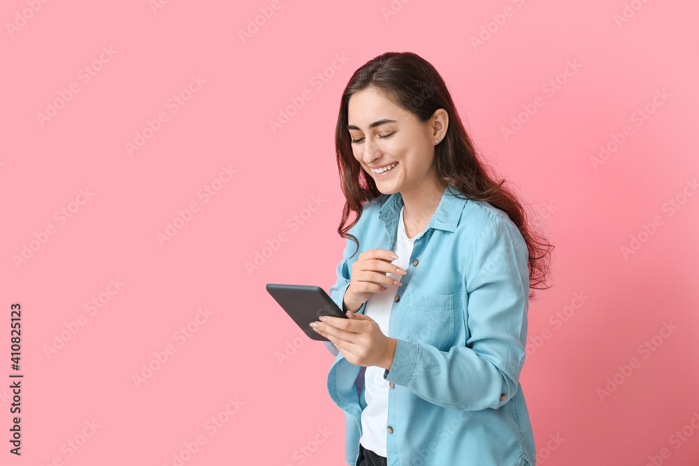 Young woman with e-reader on color background Young woman with e-reader on color background