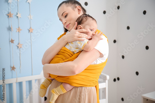 Young mother with little ba...
