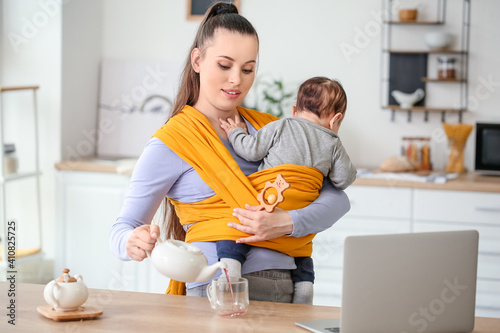 Young mother with little ba...