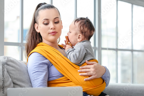 Young mother with little ba...