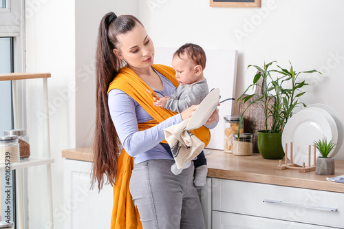 Young mother with little ba...