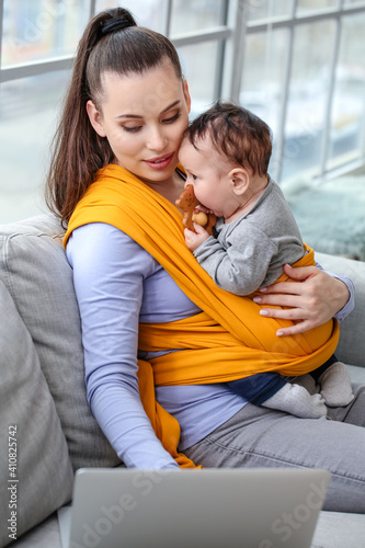 Young mother with little ba...