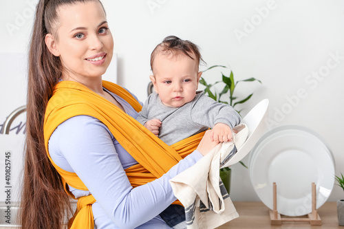 Young mother with little ba...