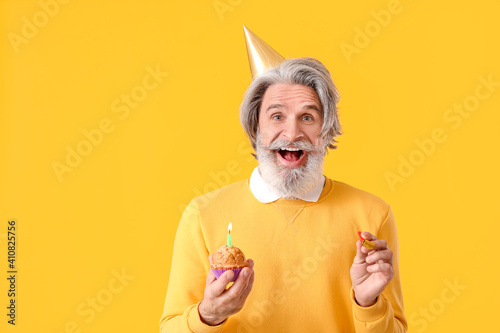 Mature man celebrating birt...